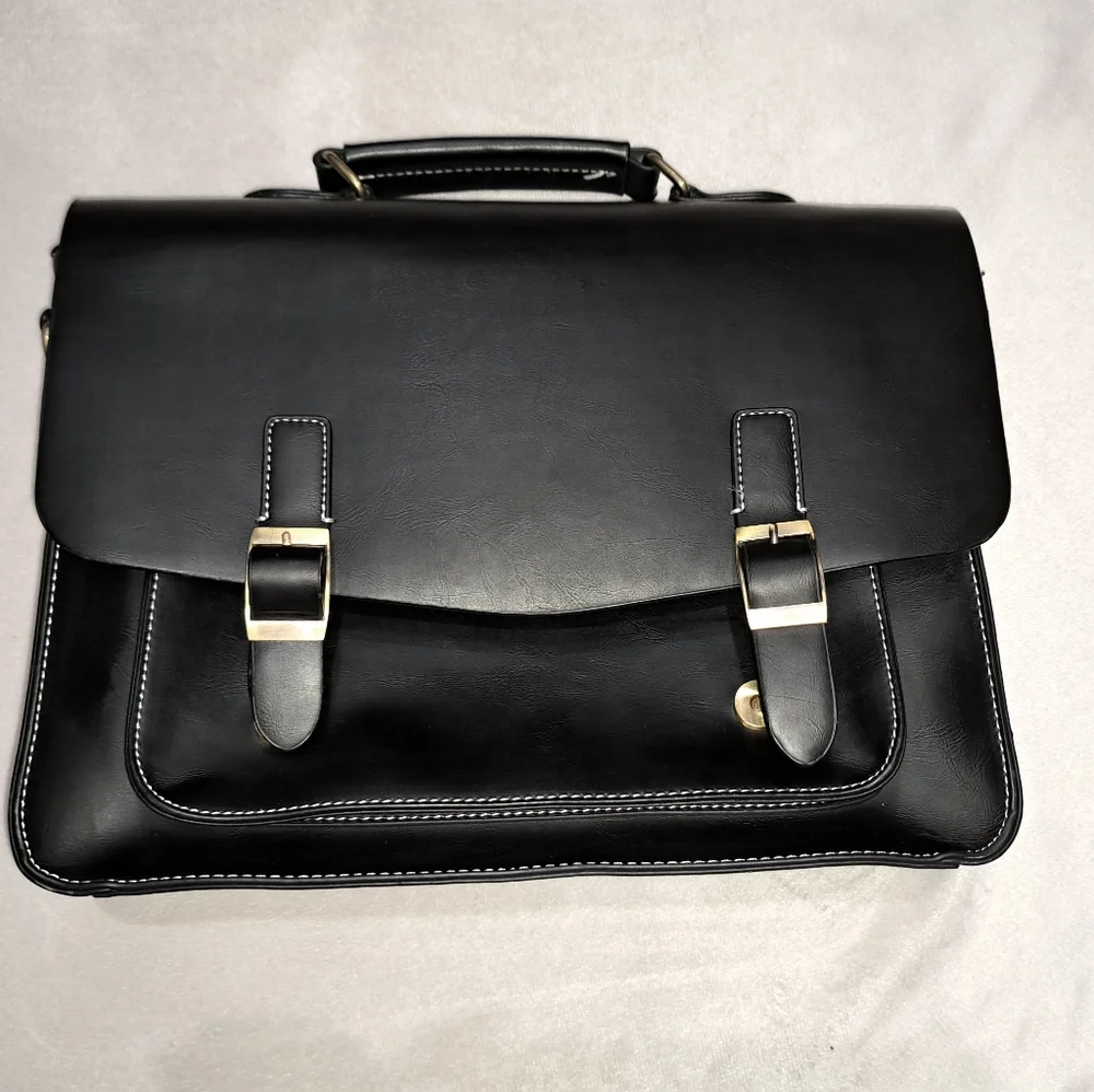 Leather like briefcase. Holds a 13 inch laptop.